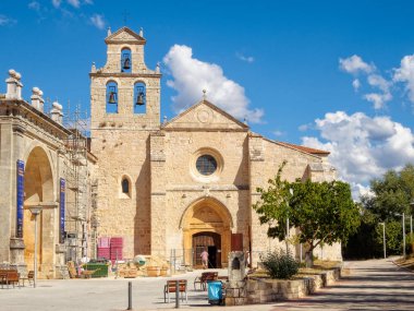 Facade and bell gable of the church - San Juan de Ortega,   Castile and Leon, Spain clipart