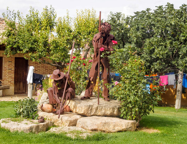 Rusty metal statue of two pilgrims in the courtyard of the En El Camino hostel (albergue) - Boadilla del Camino, Castile and Leon, Spain, 15 September 2014
