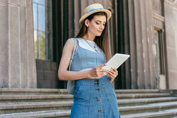 Attractive Smiling Girl Hat Using Digital Tablet While Standing Stairs — Stock Photo, Image