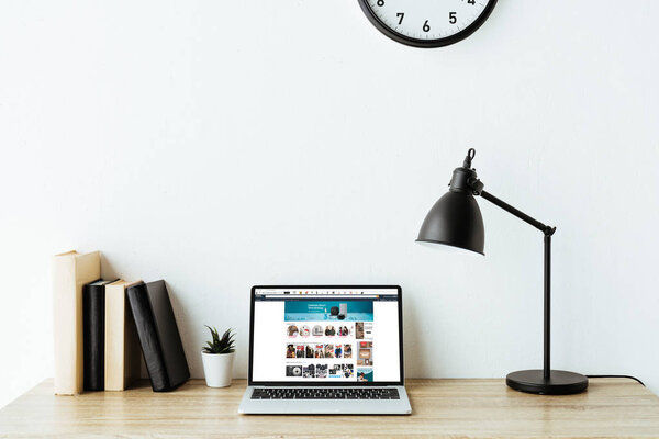laptop with amazon website on screen on work desk at office