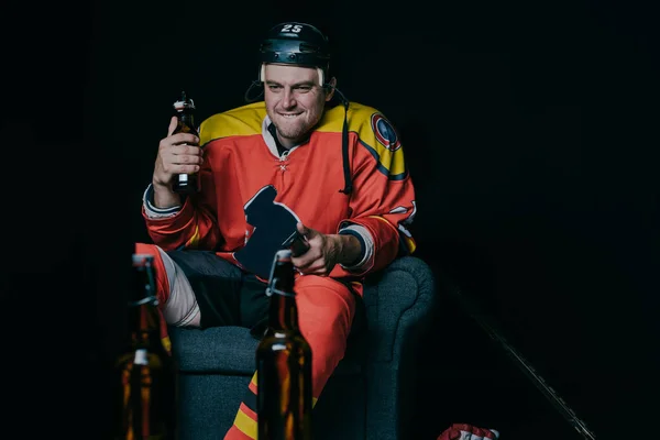 Emotional Hockey Player Holding Beer Bottle Using Remote Controller While — Stock Photo, Image