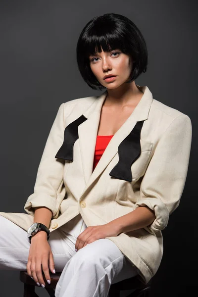 Attractive Young Woman Stylish Jacket Untied Bowtie Sitting Chair Isolated — Stock Photo, Image