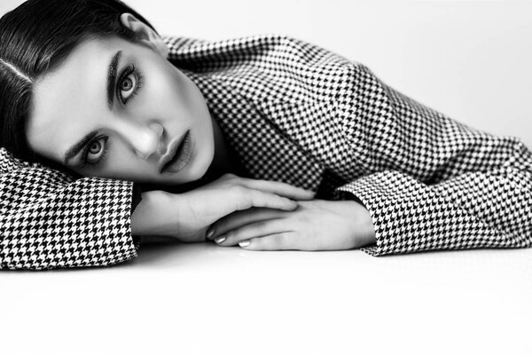 beautiful fashionable woman in vintage elegant jacket, isolated on grey, black and white