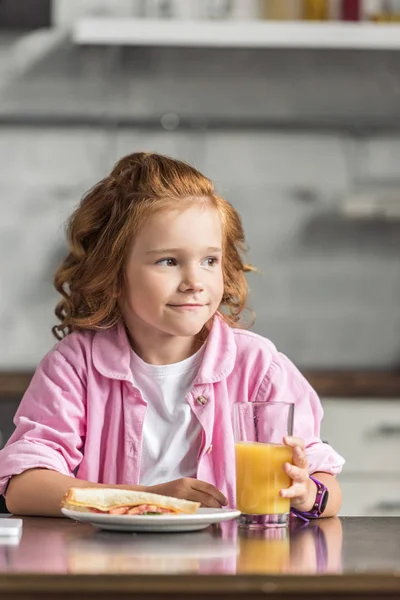 Adorable Little Child Sandwich Orange Juice Looking Away — Stock Photo, Image