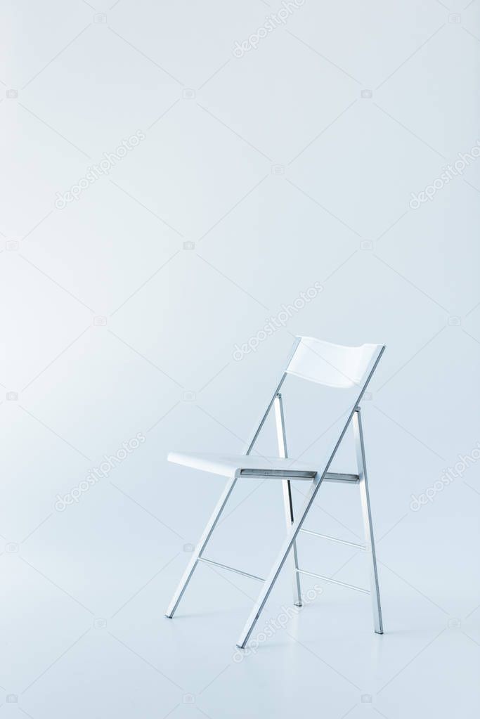 one white chair, isolated on white with copy space