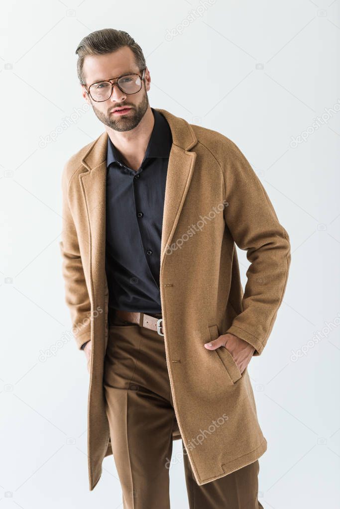 fashionable man in eyeglasses and brown coat, isolated on white