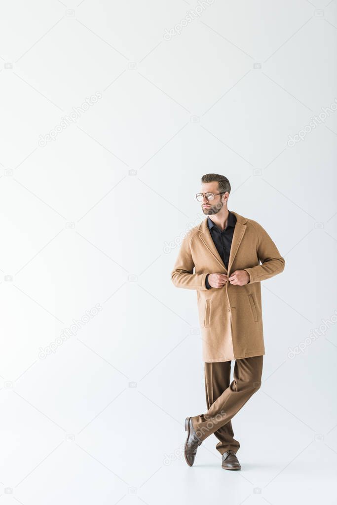 handsome man posing in stylish autumn outfit, isolated on white