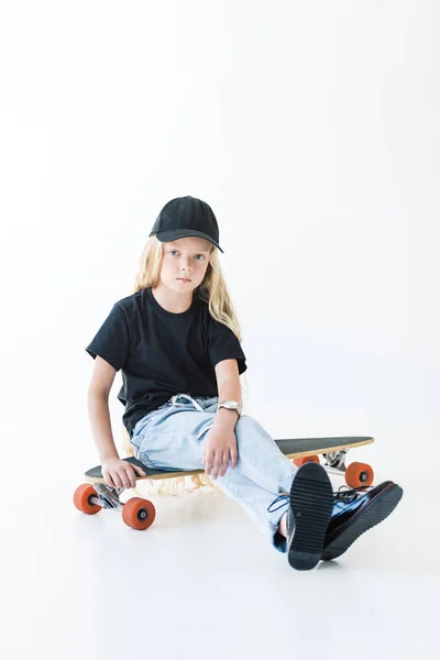Adorable Child Long Curly Hair Sitting Longboard Looking Camera Isolated — Free Stock Photo