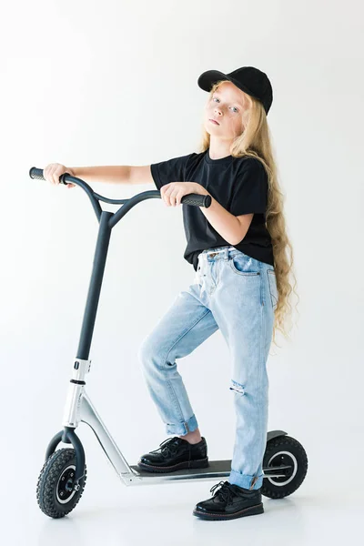 Full Length View Child Black Shirt Cap Riding Scooter Looking — Free Stock Photo