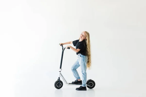 Full Length View Kid Long Curly Hair Riding Scooter Looking — Stock Photo, Image