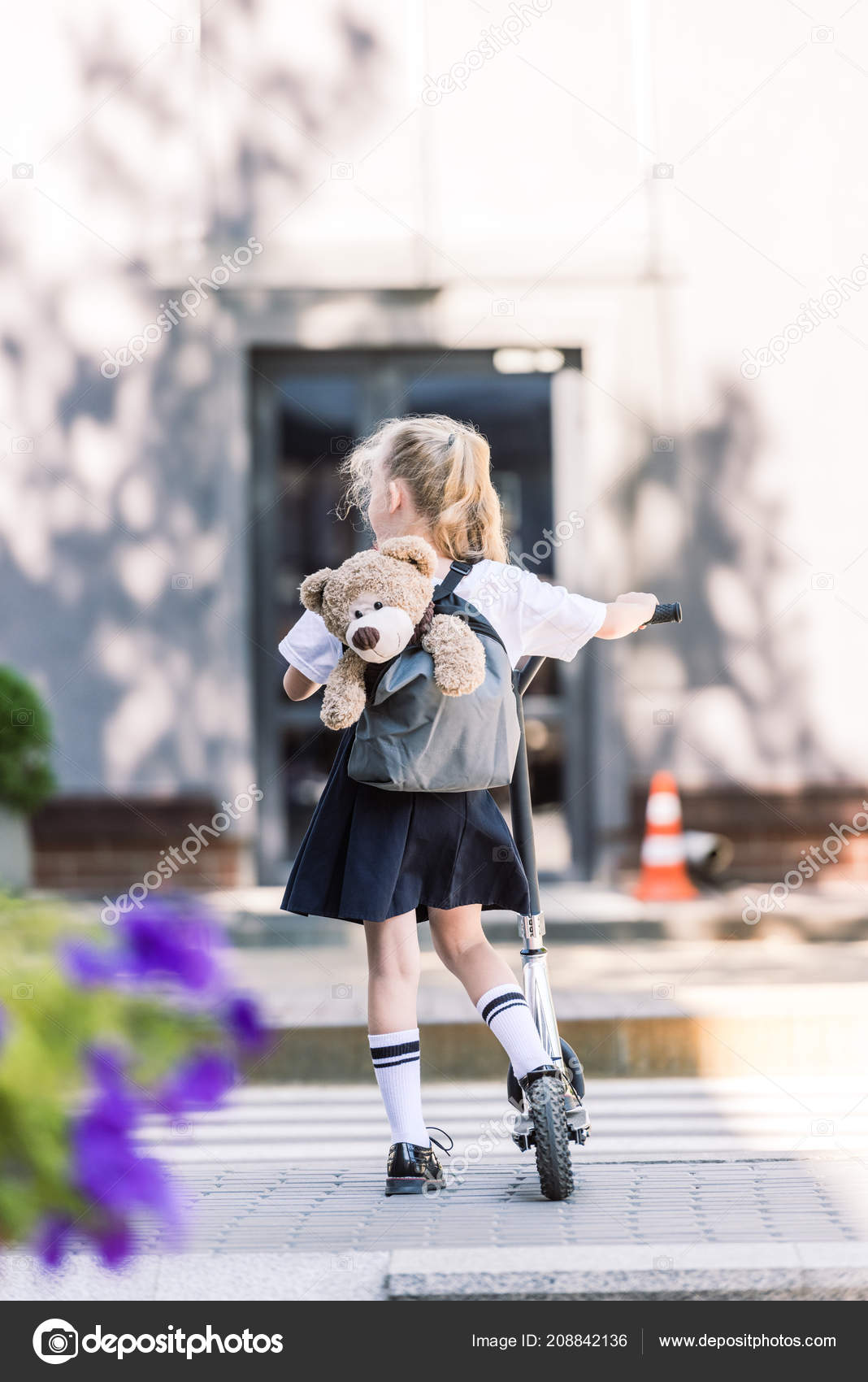 girl rides teddy bear