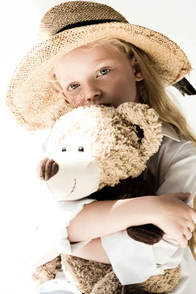 Beautiful Child Straw Hat Hugging Teddy Bear Looking Camera White — Free Stock Photo