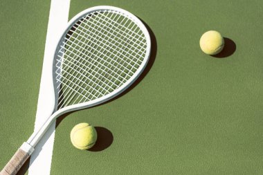 close up view of tennis equipment on green tennis court clipart