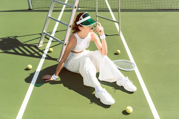 Young Woman Fashionable White Clothing Cap Sitting Tennis Court Racket — Stock Photo, Image