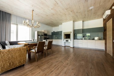 interior view of stylish empty kitchen and dining room  clipart