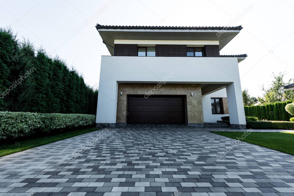 Exterior of new modern house with empty parking