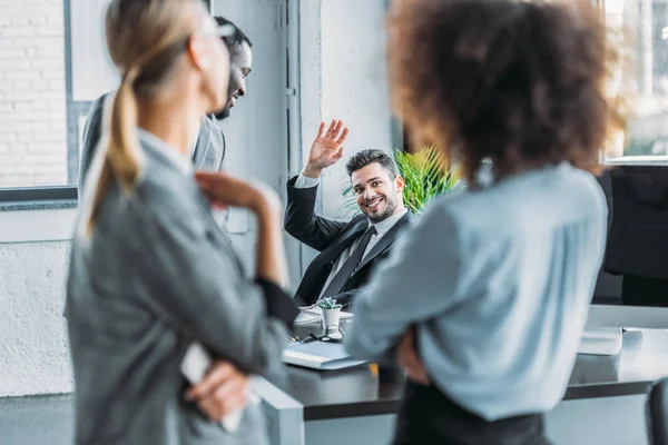 Smiling Businessman Waving Hand Multicultural Colleagues Office — Stock Photo, Image