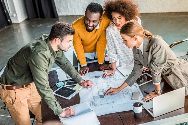 High Angle View Multicultural Businesspeople Blueprint Office — Stock Photo, Image