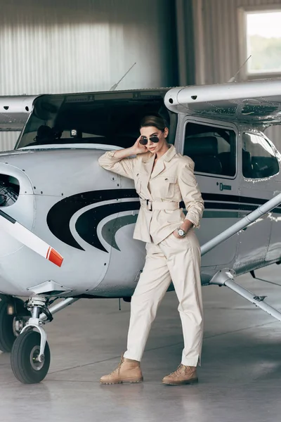 Fashionable Young Woman Sunglasses Jacket Posing Aircraft Hangar — Stock Photo, Image