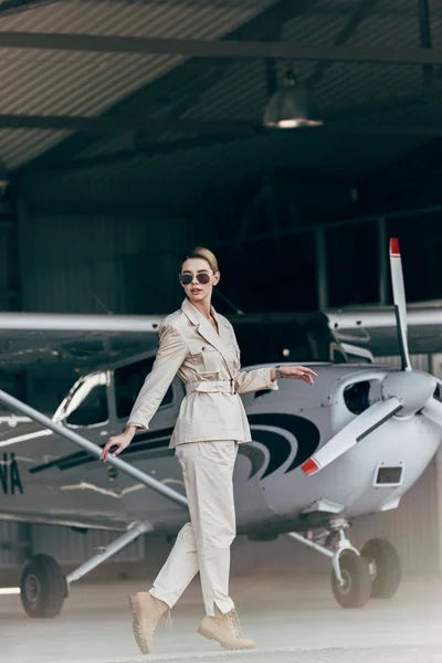 Fashionable Young Woman Sunglasses Jacket Posing Airplane — Free Stock Photo