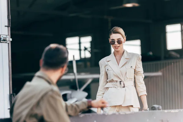 Selective Focus Beautiful Young Woman Sunglasses Jacket Walking Boyfriend Hangar — Stock Photo, Image