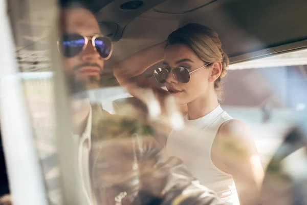 Confident Male Pilot Sunglasses Leather Jacket Sitting Girlfriend Cabin Airplane — Free Stock Photo