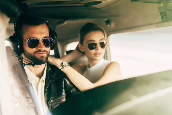 Handsome Male Pilot Headset Sunglasses Sitting Girlfriend Cabin Airplane — Stock Photo, Image