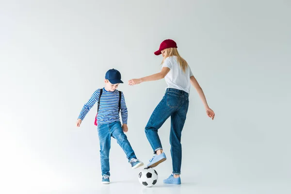 Mother Red Cap Son Backpack Playing Football White — Free Stock Photo