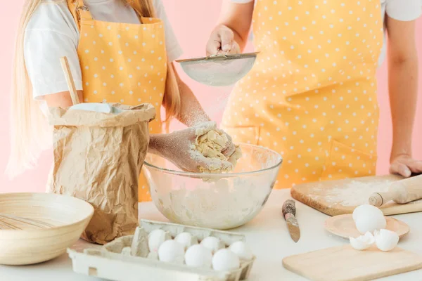 Cropped Shot Mother Daughter Yellow Aprons Preparing Dough Together Isolated — Free Stock Photo