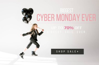 fashionable child in trendy suit jumping with black balloons on grey, black friday sale banner clipart