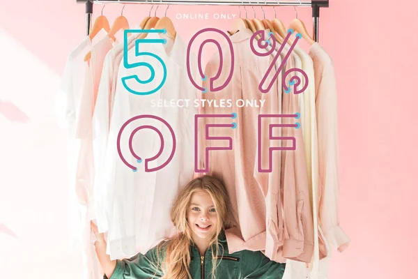 Cheerful Charming Kid Trendy Overalls Sitting Clothes Hangers Sale Banner — ストック写真