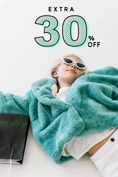 Beautiful Stylish Child Turquoise Fur Coat Lying Black Shopping Bag Royalty Free Stock Photos