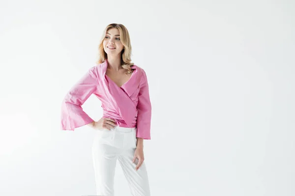 Portrait of attractive pensive woman in pink blouse posing isolated on white — Stock Photo