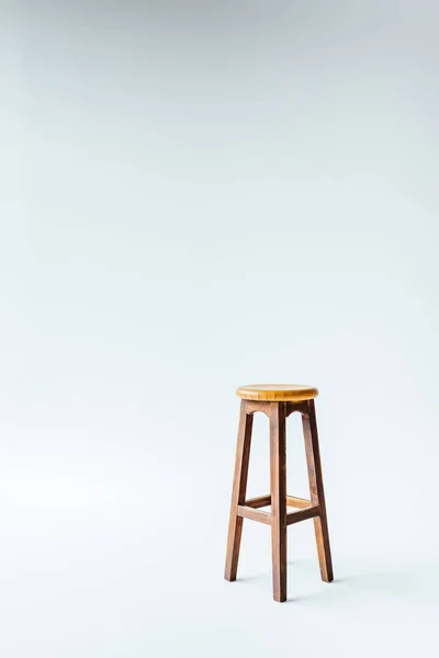 Single vintage wooden stool on white — Stock Photo
