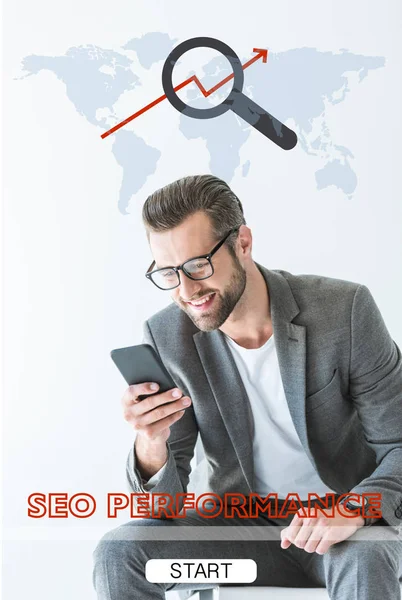 Developer in gray suit using smartphone, isolated on white with SEO performance and world map — Stock Photo