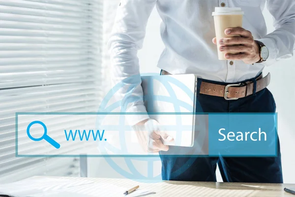 Cropped view of seo developer holding laptop and coffee to go, with website search bar — Stock Photo