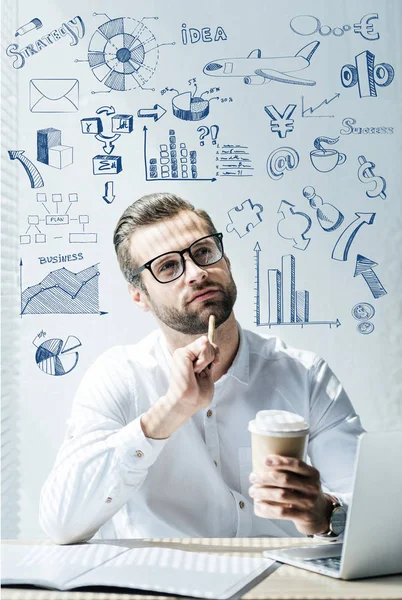 Thoughtful developer sitting at workplace with SEO ideas and icons — Stock Photo