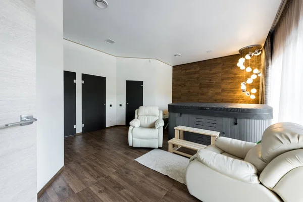 Interior view of modern room with armchairs and closed jacuzzi in spa — Stock Photo