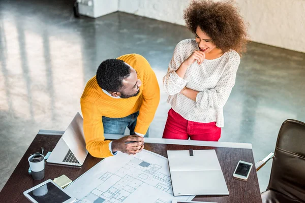 High angle view of smiling african american businesspeople looking at each other — Stock Photo