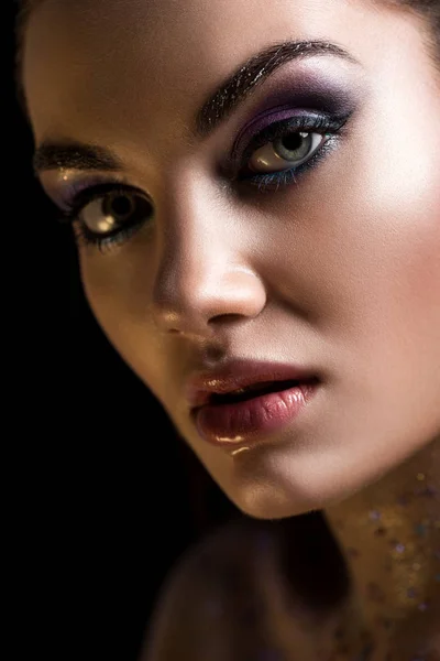 Elegant girl posing with makeup, isolated on grey — Stock Photo