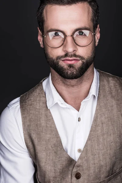 Portrait of elegant bearded man posing in eyeglasses, isolated on grey — Stock Photo