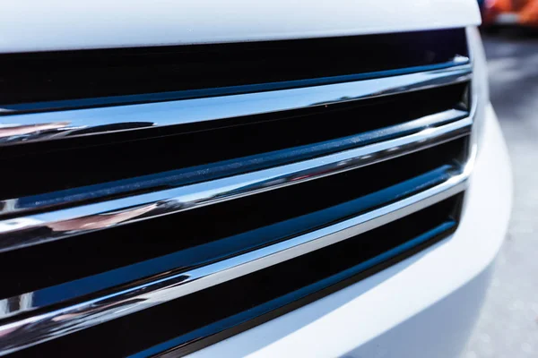 Close up of white new car bumper on street — Stock Photo