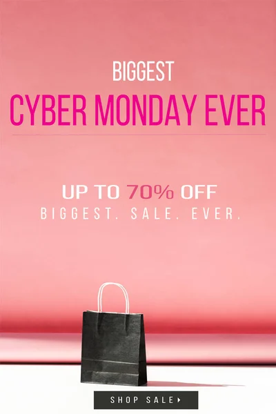 One black shopping bag on pink with copy space, cyber monday sale banner concept — Stock Photo