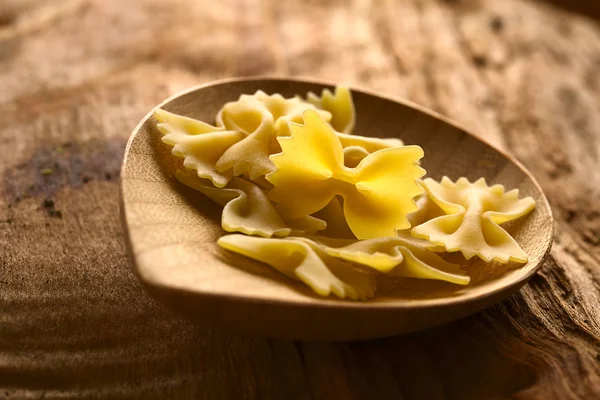 Raw Farfalle Bow Tie Pasta Small Wooden Plate Photographed Natural — Stock Photo, Image
