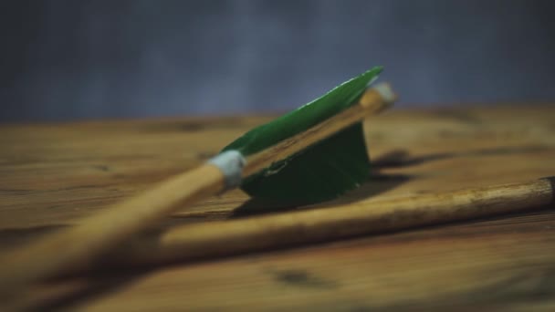 Rotating Old Green Wooden Arrow Wooden Table Beautiful Dark Background — Stock Video