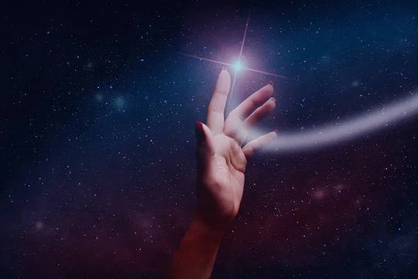 Forefinger touches a new star in infinite space.