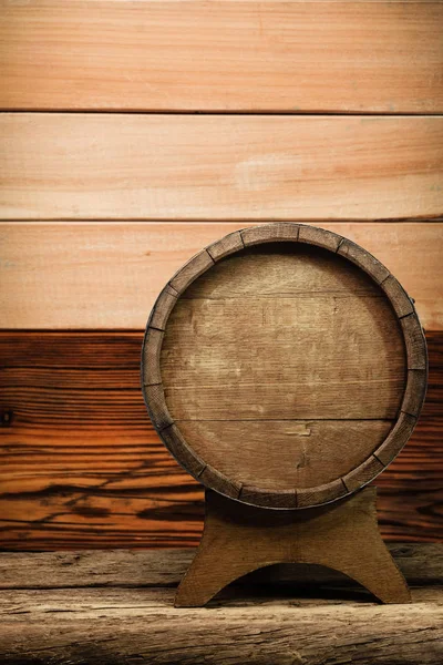 Wooden barrel and worn old table of wood.