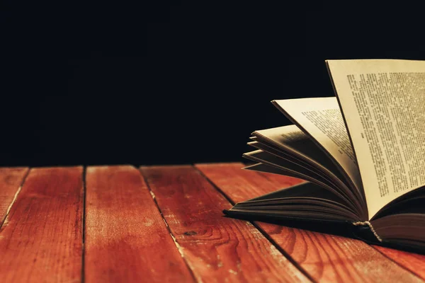 One Open Old Book Red Wooden Table Beautiful Dark Background — Stock Photo, Image