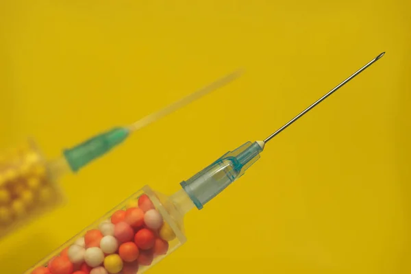 Two Syringe Filled Colorful Nano Balls Yellow Background Innovative Medical — Stock Photo, Image