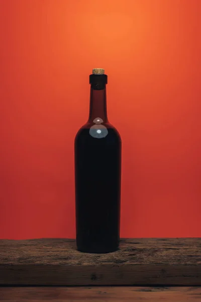 Bottle Red Wine Old Oak Wooden Table Coral Orange Background — Stock Photo, Image